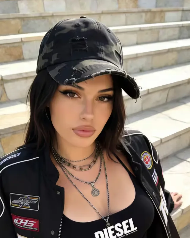Adult AI-generated woman wearing a dark jacket and cap